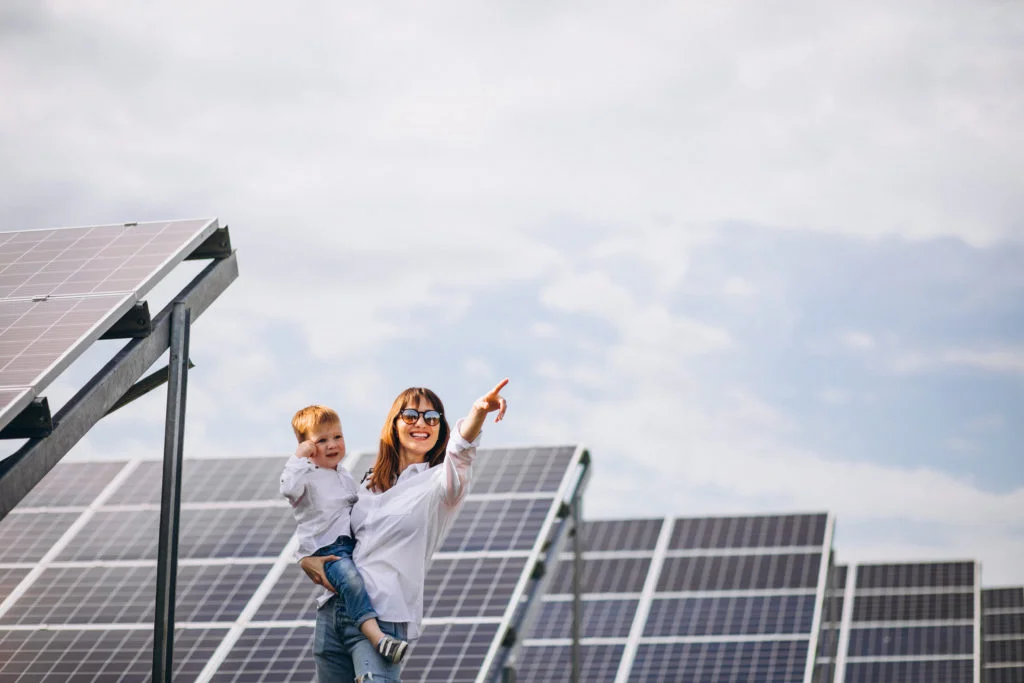 mother-with-her-little-son-by-solar-panels-1024x683